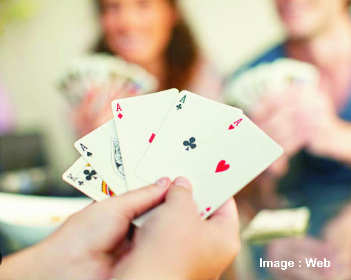 Playing with magic. 4 People playing Cards. Sexy игральные карты с девушками. Hands holding playing Cards. Play Cards stock pic.